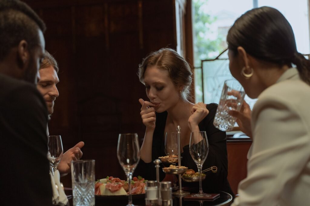 Two people talking over a quiet dinner at a simple restaurant table