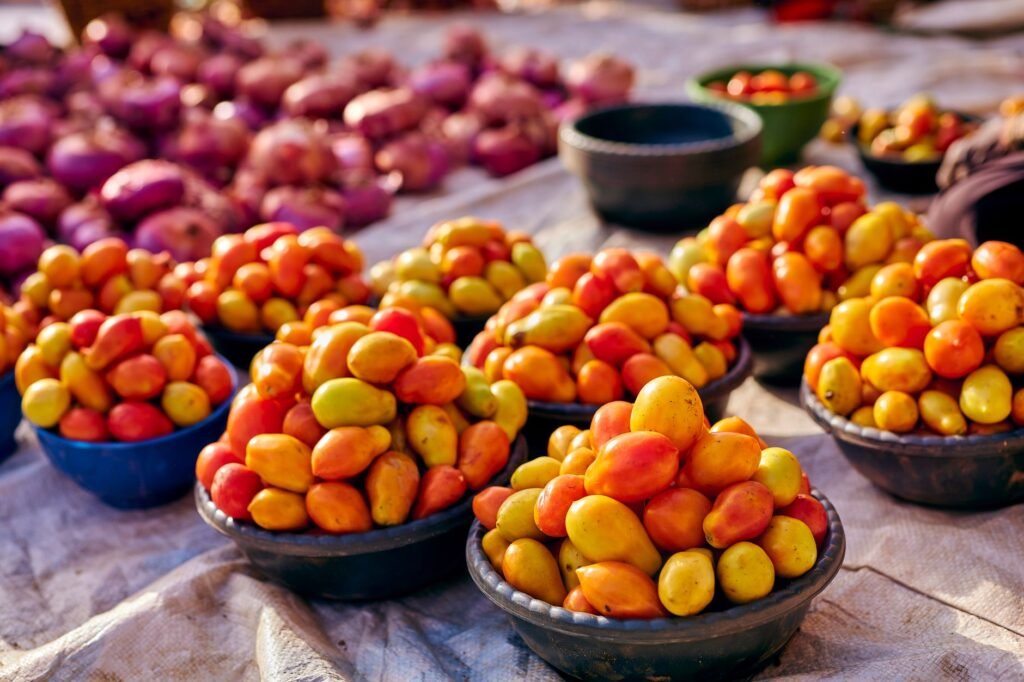 Fresh vegetables and plantain on sale at a market stall near Adeiso