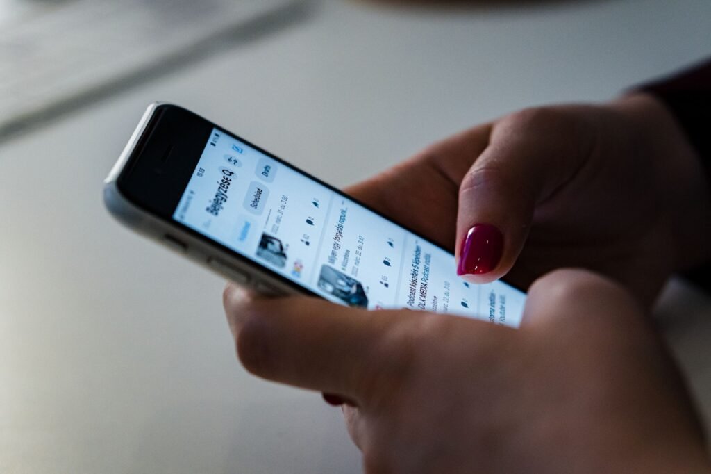 Adult reviewing an online profile before sending a message
