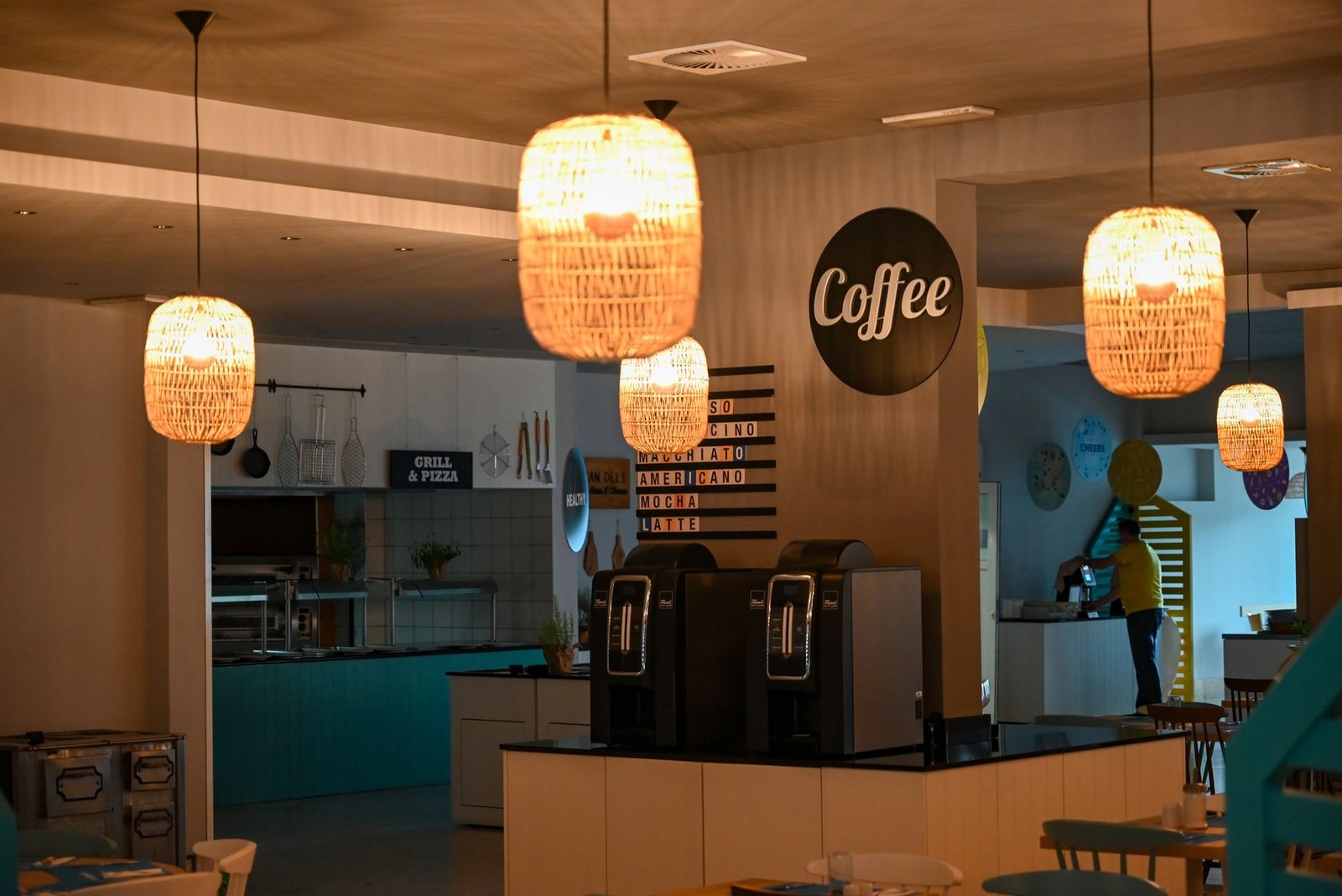 Warm café interior in Rabac, Croatia featuring ambient lighting and modern design elements.