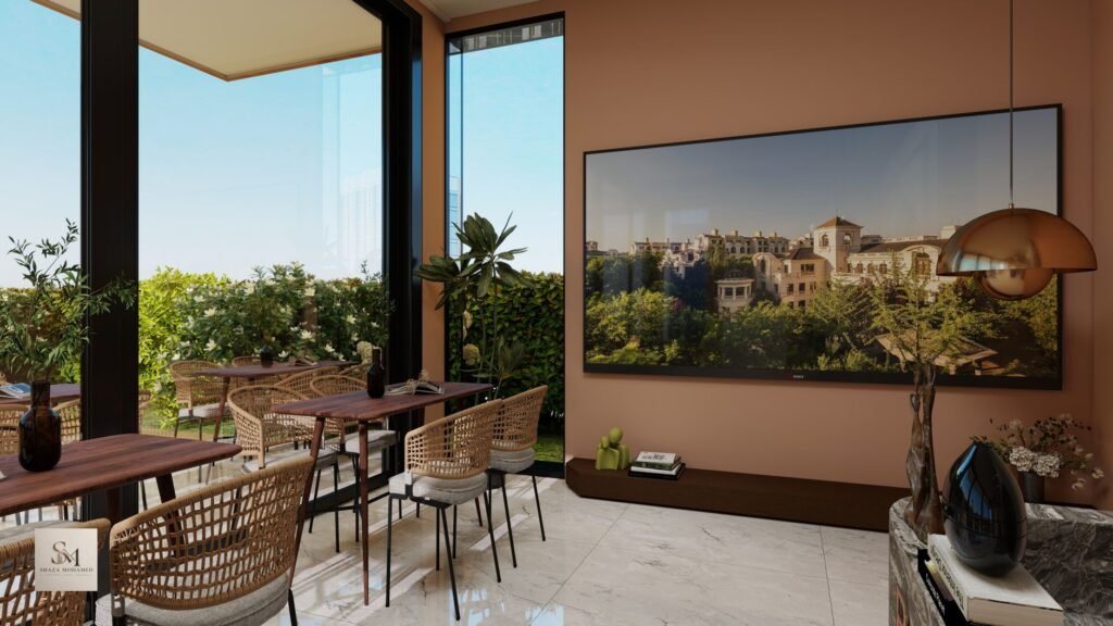 Stylish cafe interior with large windows overlooking greenery on a sunny day.