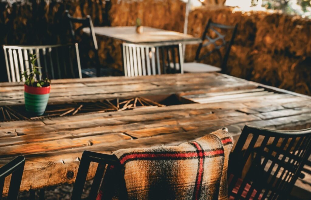 Small outdoor table set for two in the evening at a modest eatery