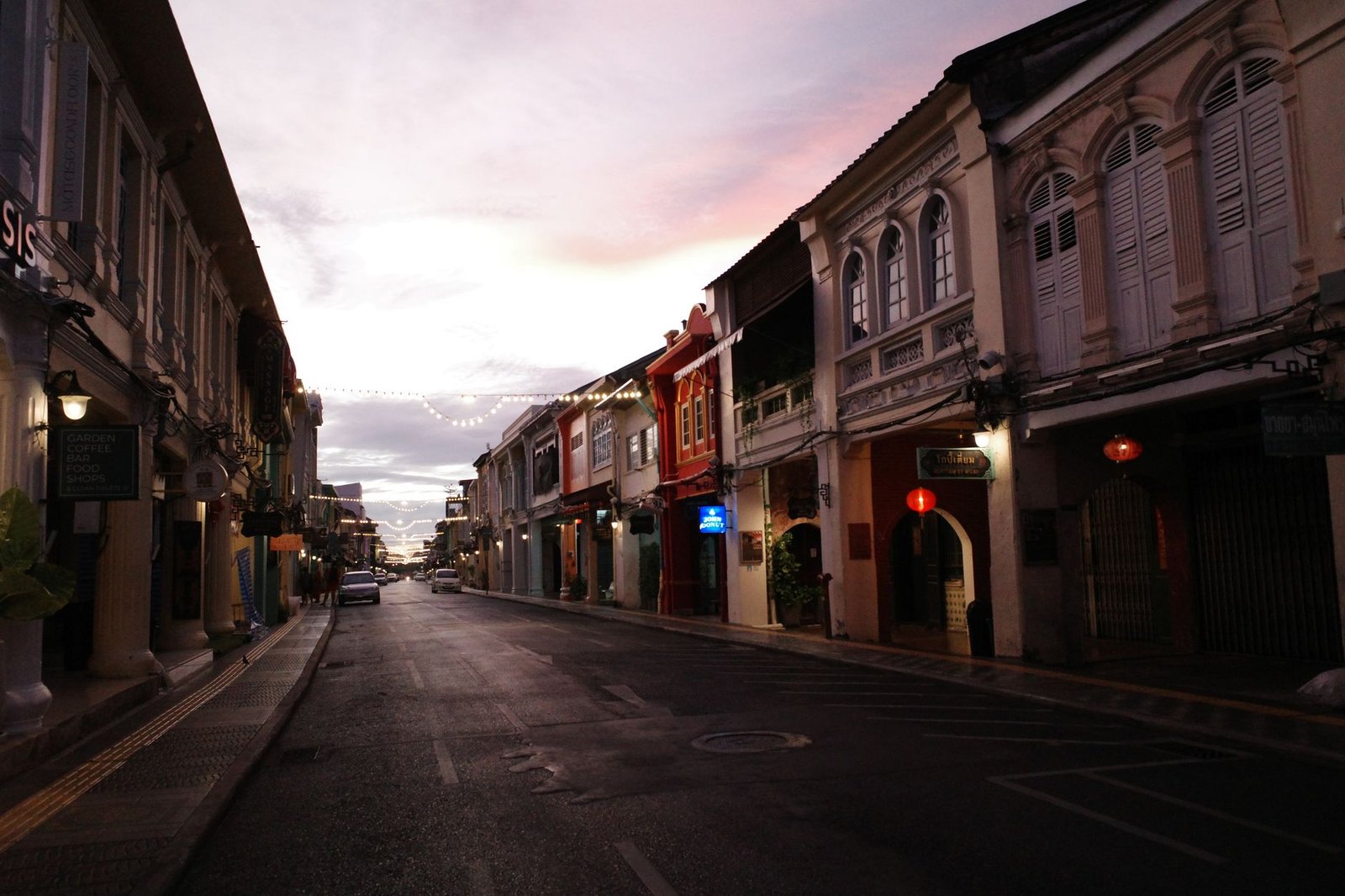 A calm Ghanaian town street at dusk