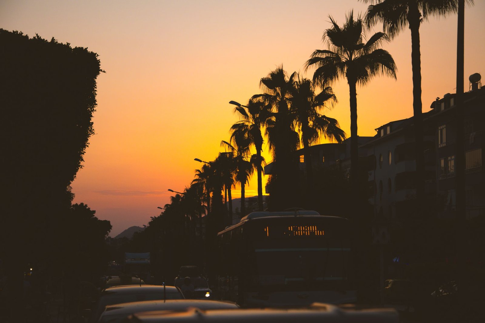 Quiet upscale street in East Legon at dusk with warm lighting