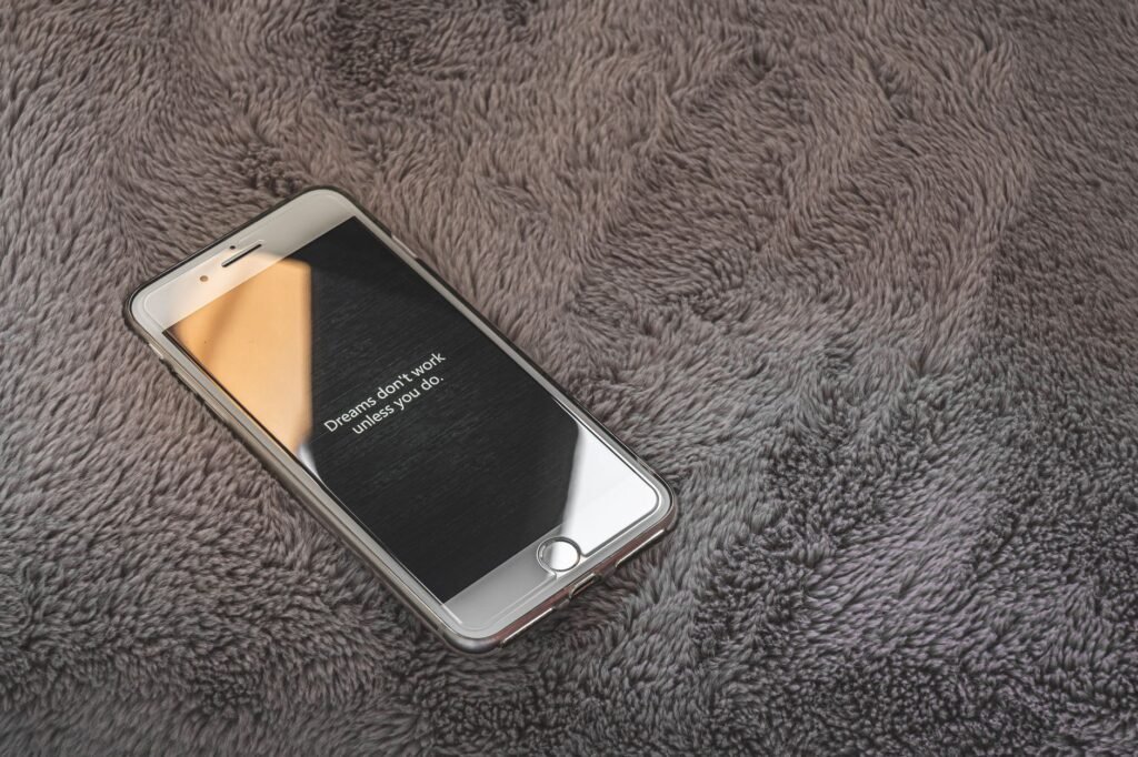Smartphone glowing in a softly lit room while browsing discreetly