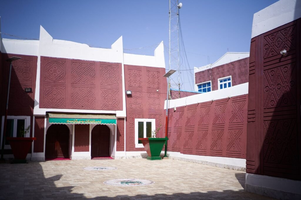 Quiet guesthouse courtyard in a small West African town in morning light