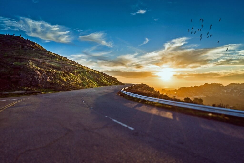 winding road, sunset, mountains, mountain landscape, street, avenue, pavement, asphalt, lane, sun, sky, road, travel, sunrise