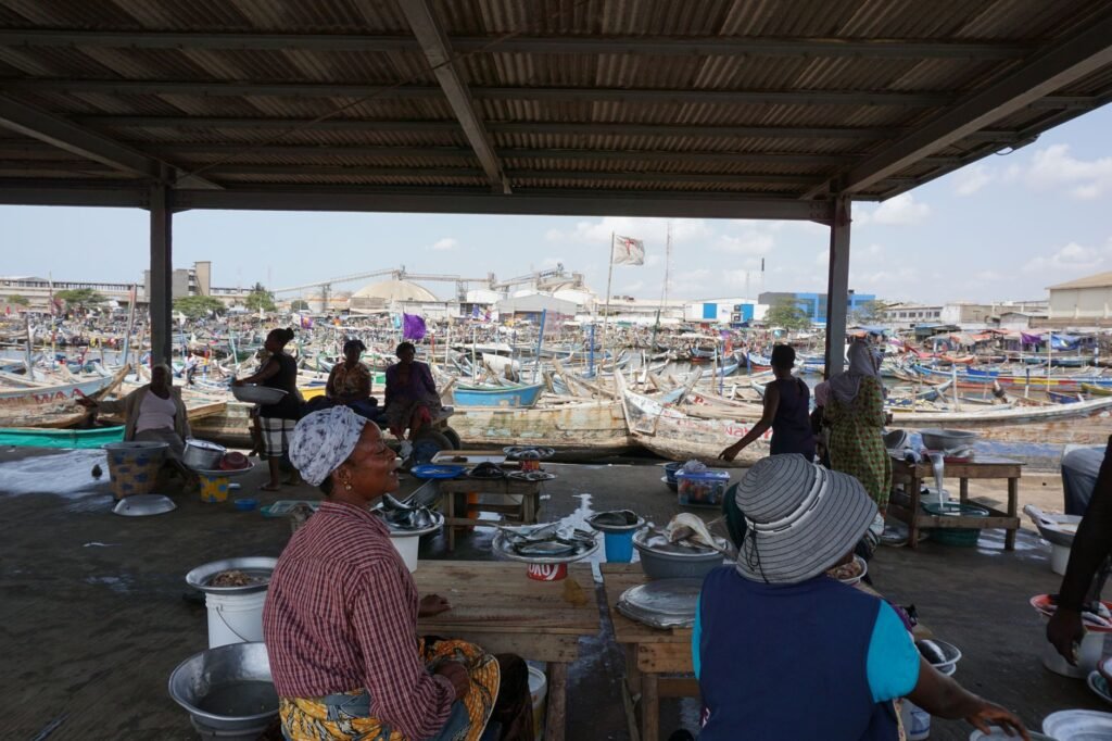 Late-morning market activity in a small coastal town in Ghana
