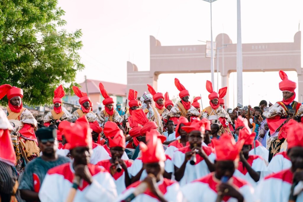 Colorful cultural event with musicians in traditional attire, showcasing community spirit.