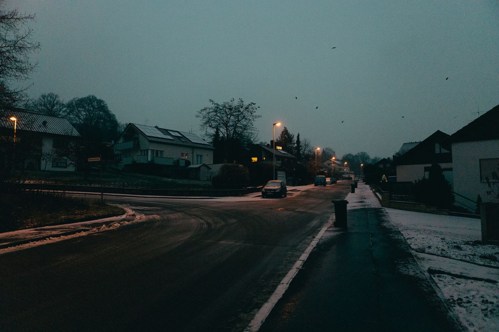 Quiet residential street in a Ghanaian suburb at dusk