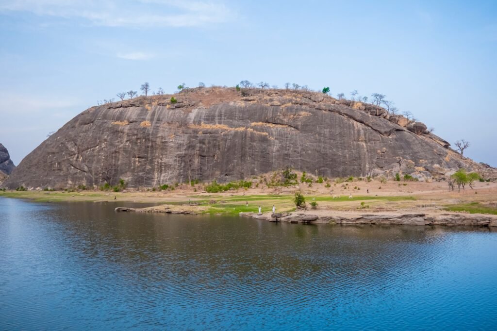 A beautiful rocky landscape in Bauchi, Nigeria with clear water and open sky.