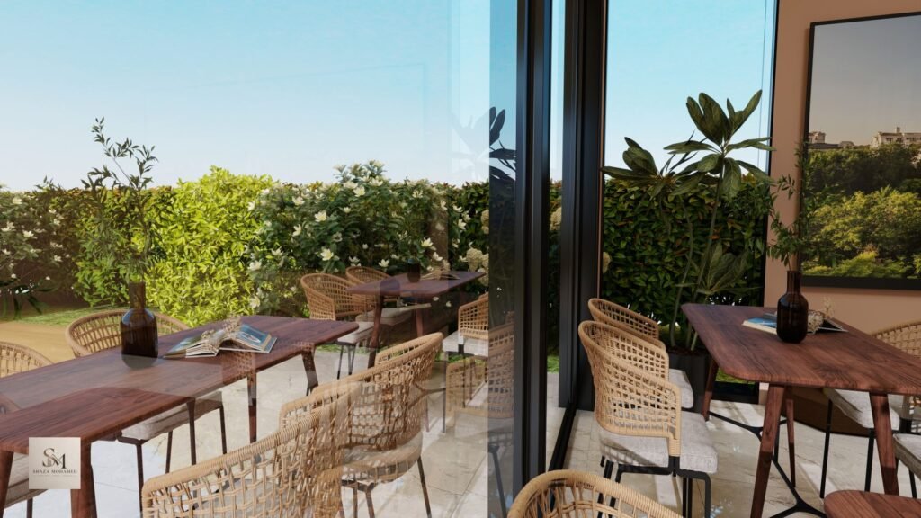 Elegant outdoor cafe setting with rattan chairs and lush greenery.