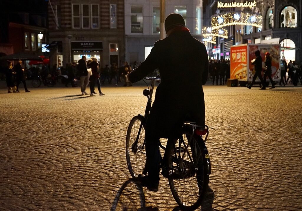 cyclist, street scene, city, urban, light, the shade, cobblestones, people, silhouette, wheel, street photography, downtown