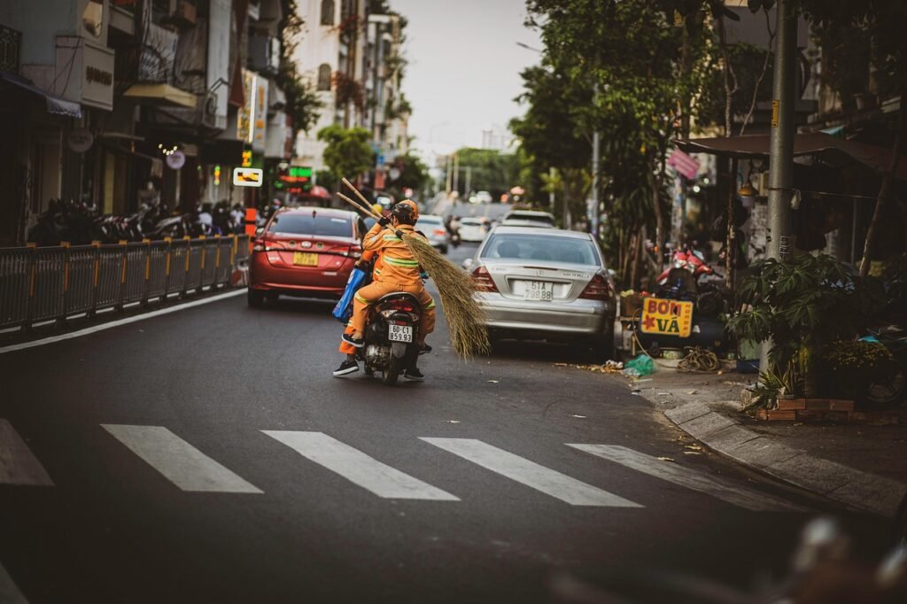 street sweeper, motorcycle, road, broom, cars, street, sidewalk, people, city, urban, life