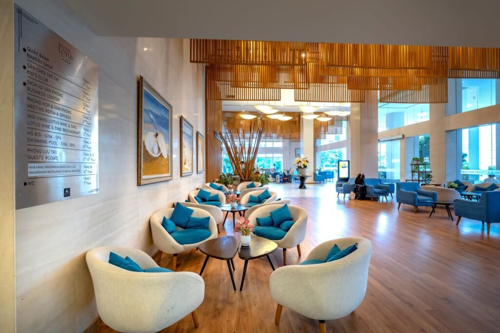 Adults in a calm hotel lounge in West Africa arranging a discreet meeting