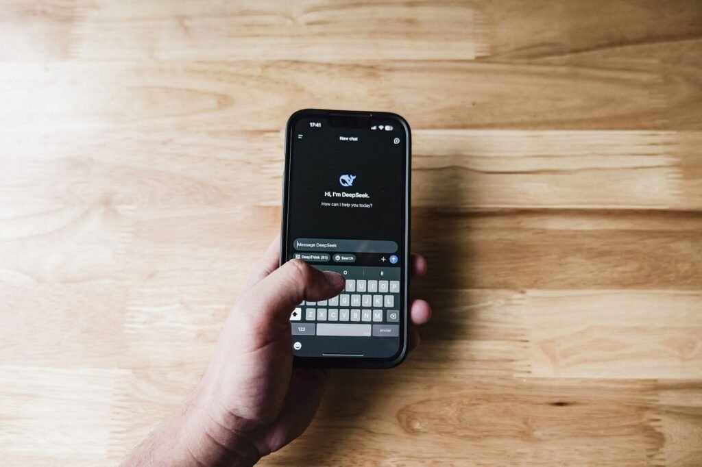 Person typing a polite introductory message on a phone before a booking
