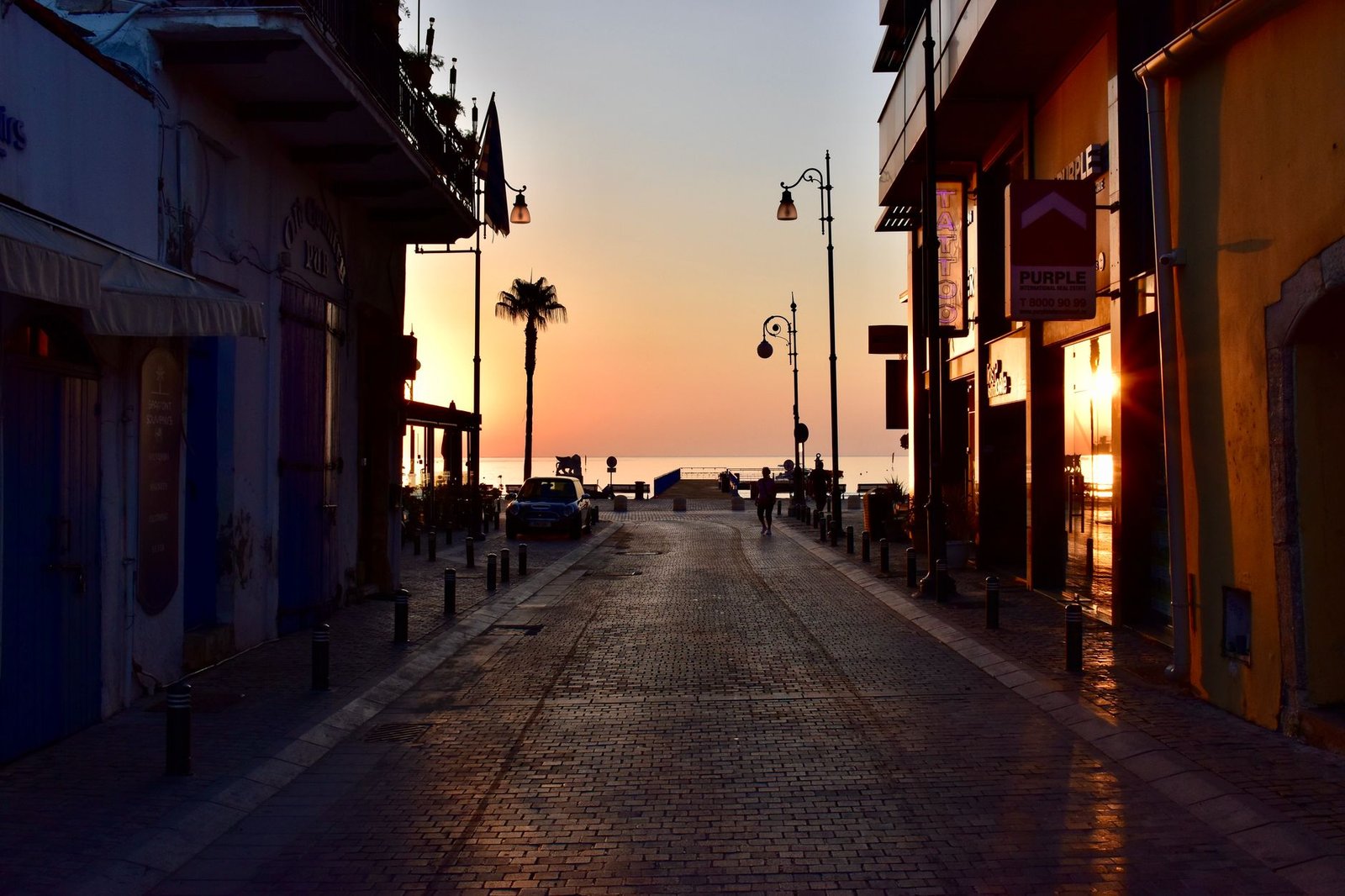 Quiet coastal street in Korle Gonno, Accra, at golden hour