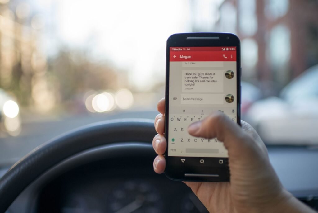Person composing a clear message on a smartphone before arranging a booking