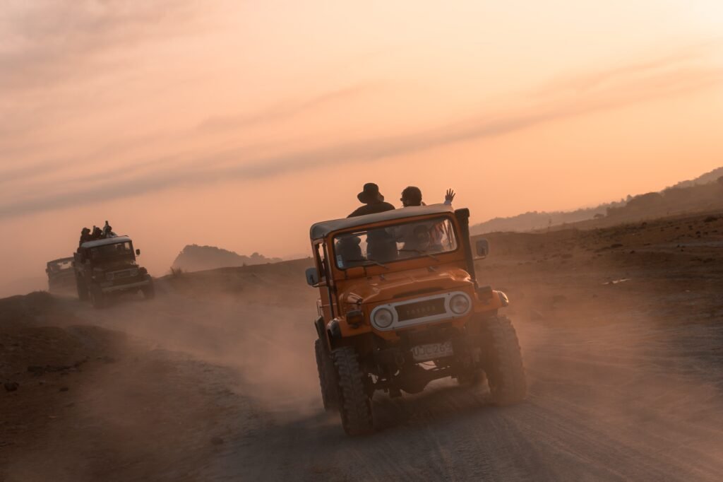 Shared transport stopping on a dusty road at dusk in the Ahafo Region