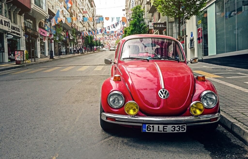 automotive, volkswagen beetle, car, city, car wallpapers, classic, classic car, old car, pavement, red car, parked car, road,