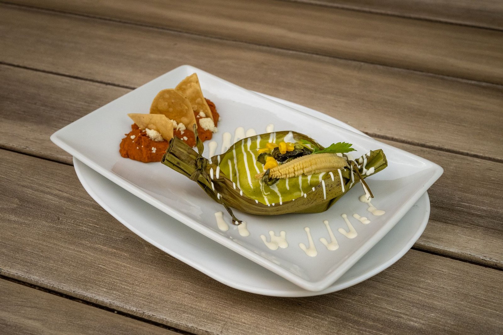 Delicious plated Mexican tamale served in a Guanajuato restaurant, capturing local flavors.