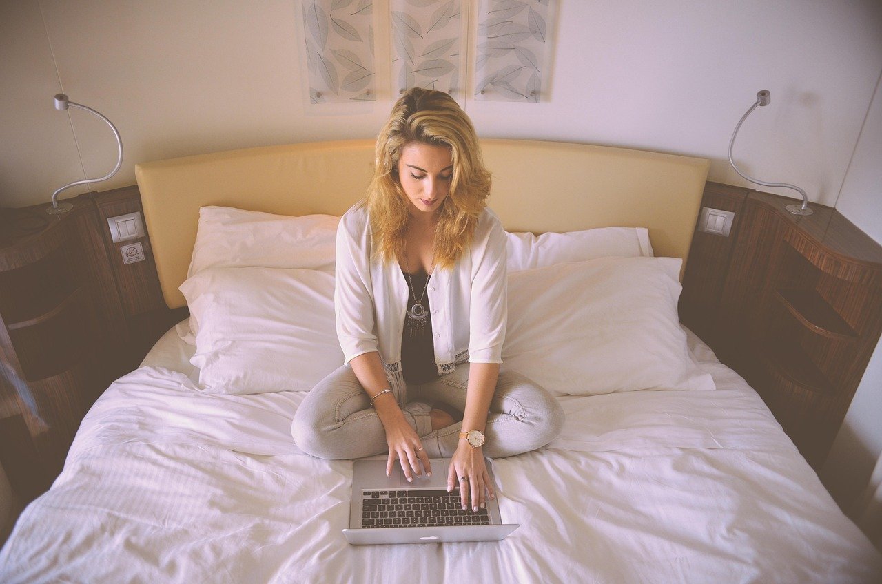 woman, working, bed, laptop, typing, female, business woman, person, computer, young, professional, concentrated, brown busin