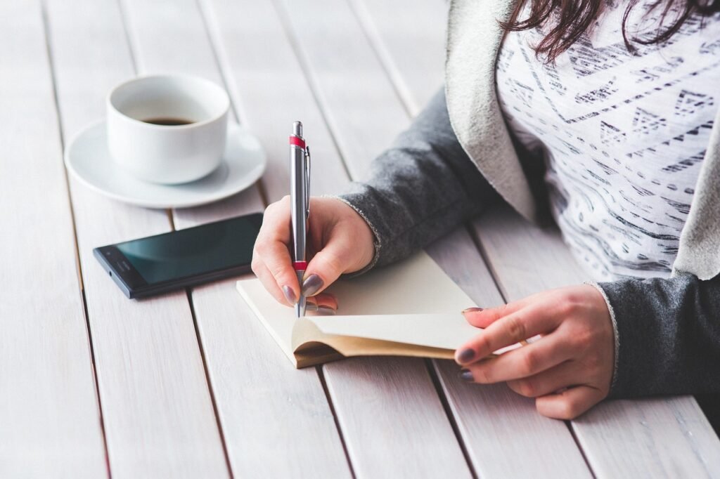 woman, write, notepad, girl, female, hand, note, business, notebook, desk, work, working, table, pen, student, young, write,