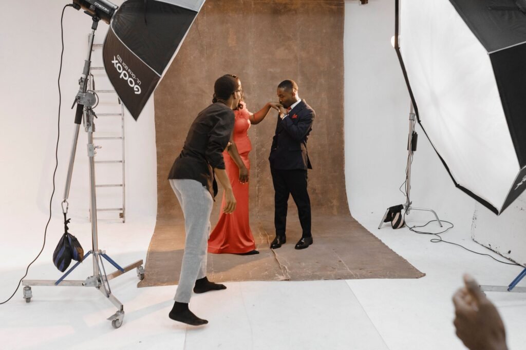Behind-the-scenes view of a professional portrait photoshoot in an Accra studio.