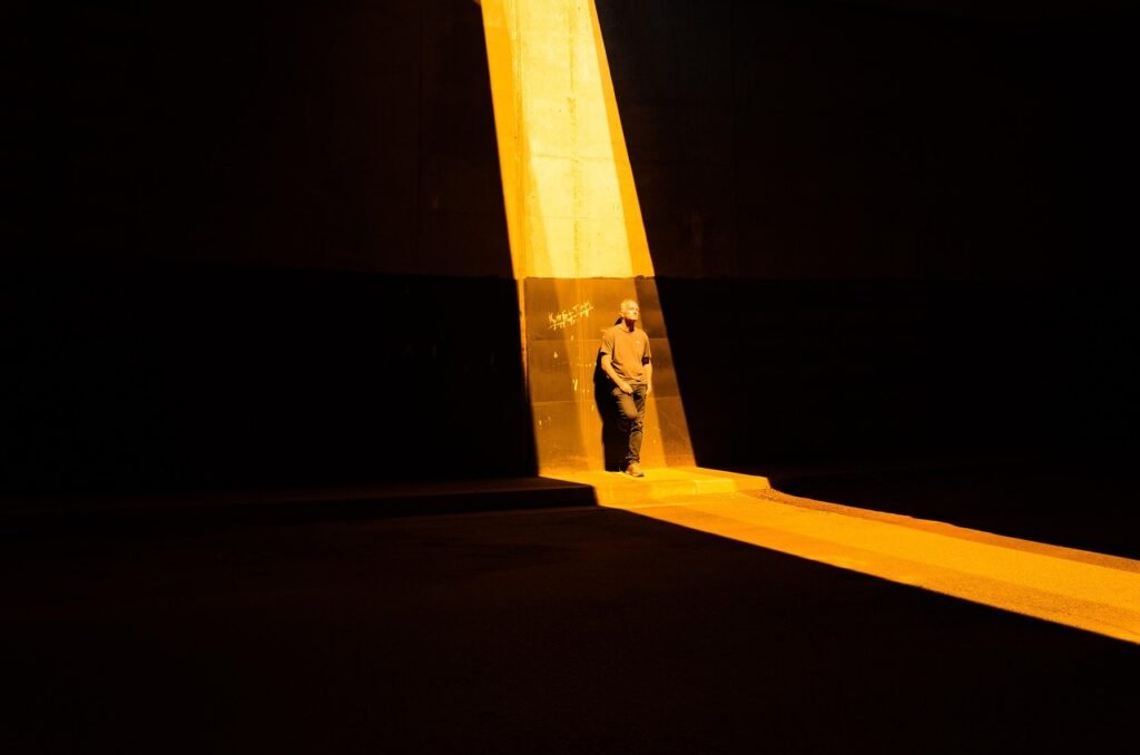 man, light, night, bridge, road, street, dark, man, light, light, light, light, light, night, road, road, street, dark, dark,