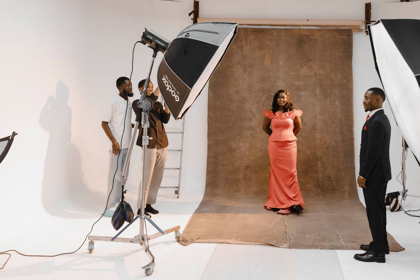 Behind-the-scenes view of a sophisticated studio portrait session.