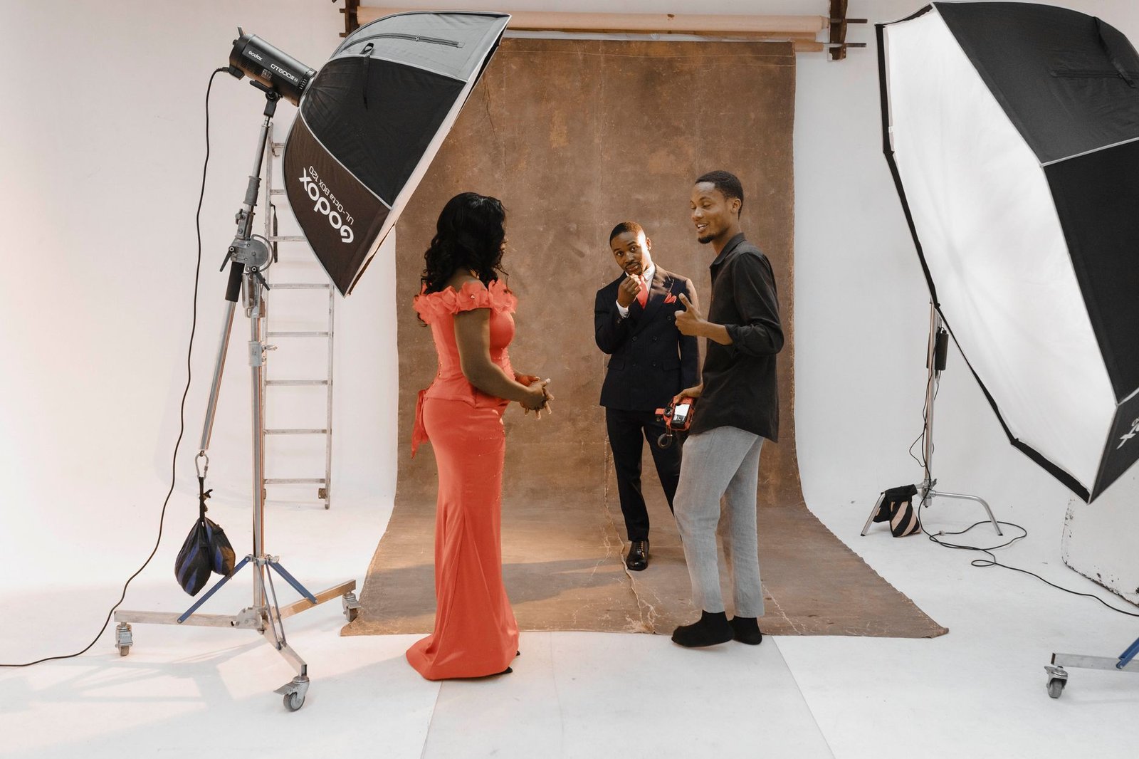 Photographers setting up a portrait shot in a well-equipped studio in Accra, Ghana.