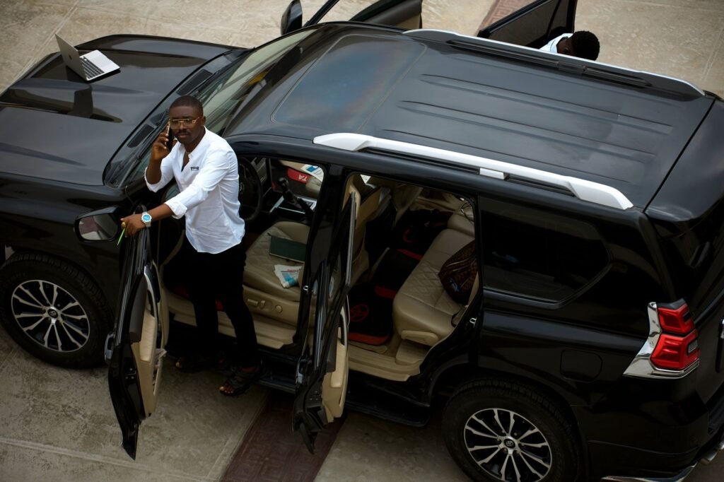 Visitor preparing a phone and transport details before leaving