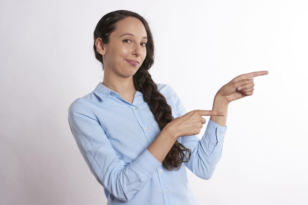 pointing, showing, woman, direction, gesturing, finger, hand, girl, point, smile, face, sale, gesture, young, female, person,