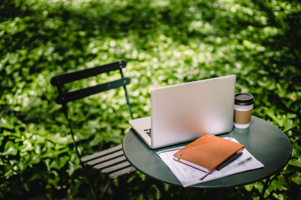 Two cups and a notebook on a table in a quiet guesthouse lounge
