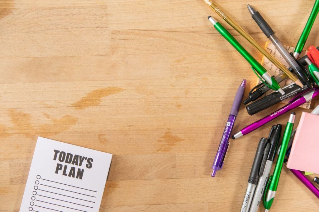 Notebook and pen used to plan a discreet meet-up