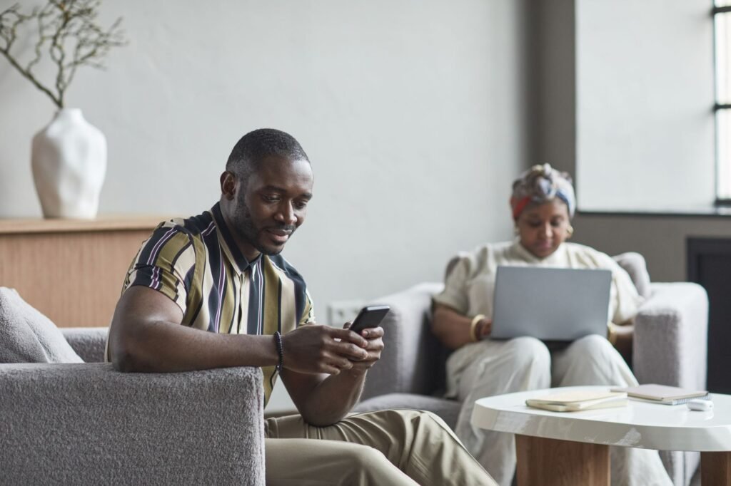 Traveller browsing a directory privately on a smartphone in Tema
