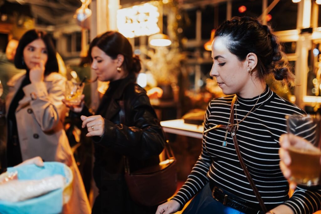 Adults socialising at an outdoor evening gathering