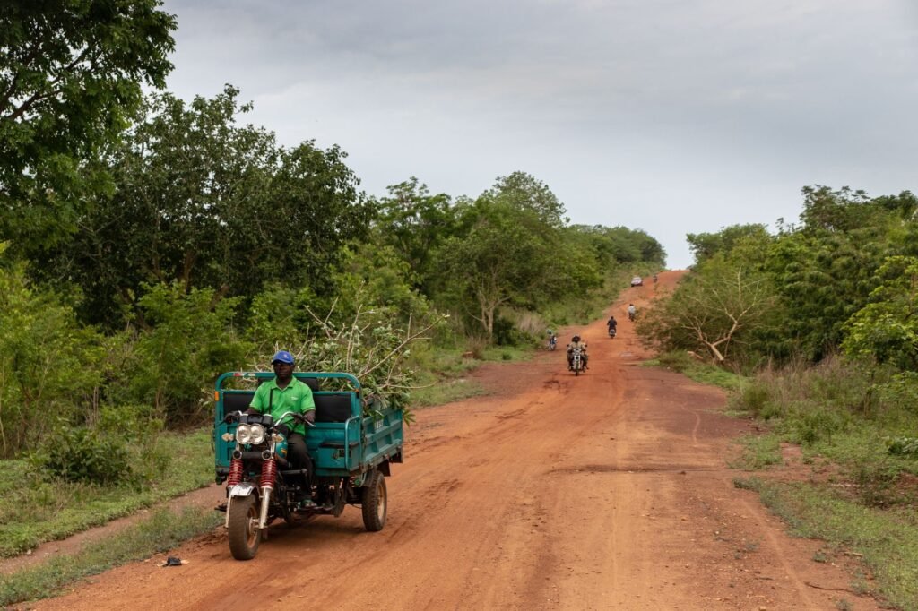 Red laterite road through the countryside of Oti Region, Ghana