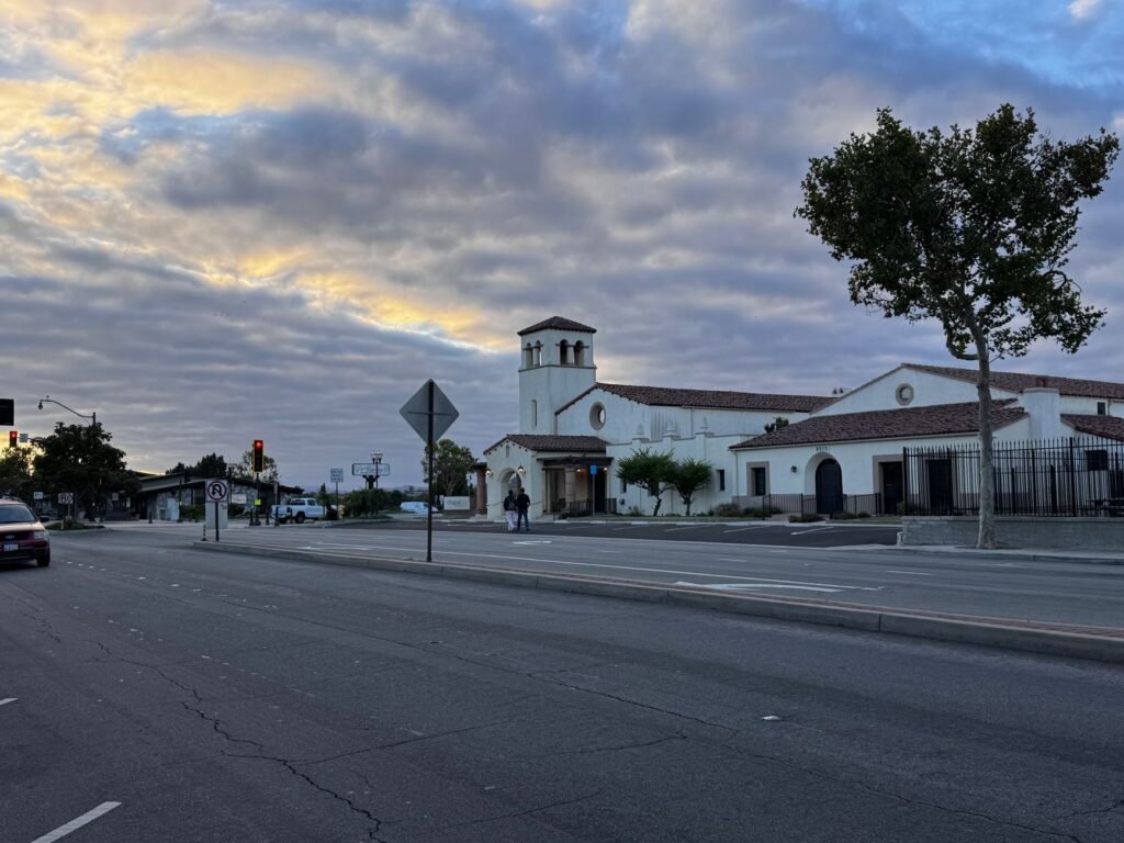 Quiet small-town street in Ghana during early evening blue hour