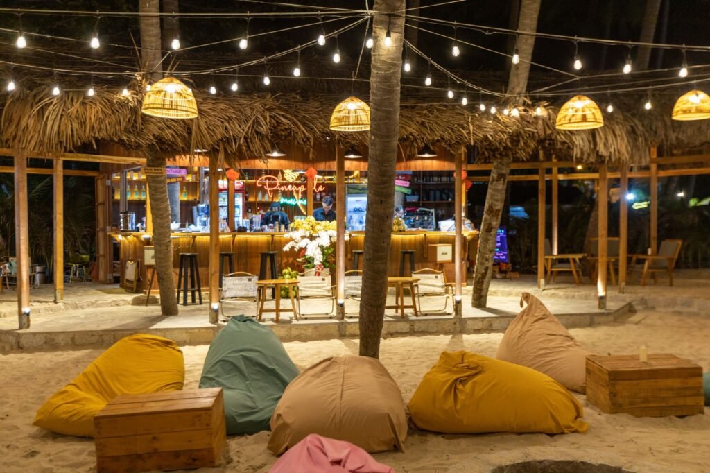 Relaxed outdoor seating area at a small Ghanaian bar in the early evening