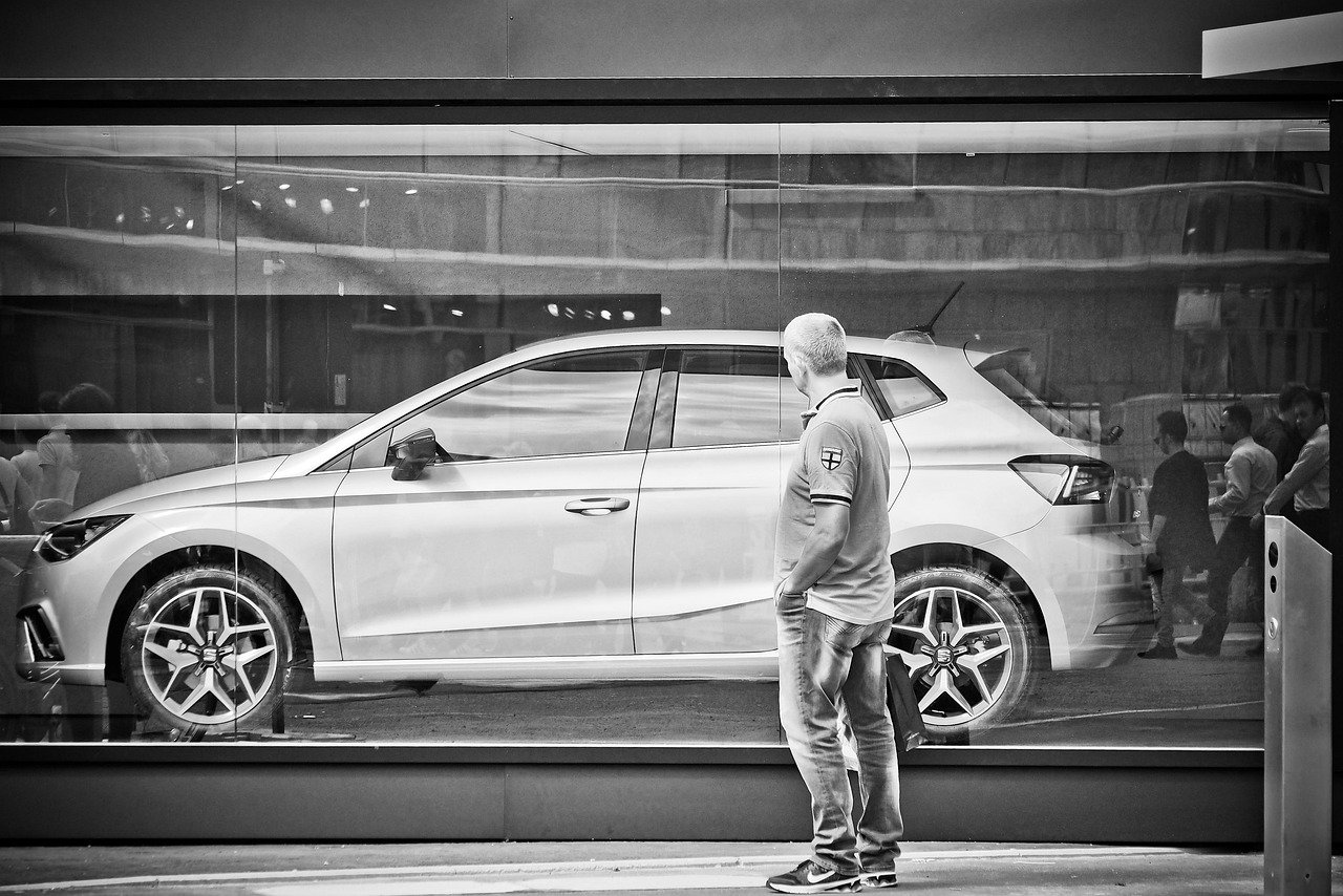 automobile, man, person, advertising, human, vehicle, scene, road, car, look at, marvel, think, to buy, purchase, thoughtful,
