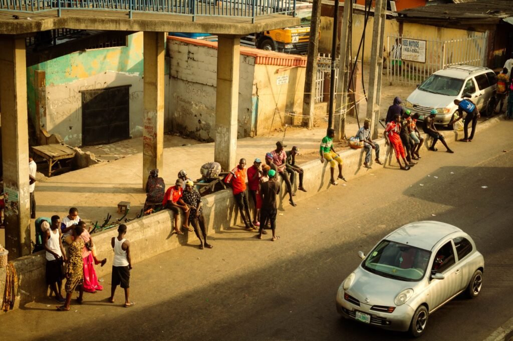 Vibrant street scene in Lagos, Nigeria with people and cars in view.