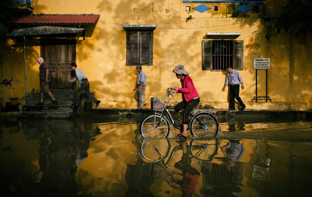 biking, street, flood, nature, city, bike, bicycle, bicycle ride, riding bike, flooding, water, water reflection, road, hoi a