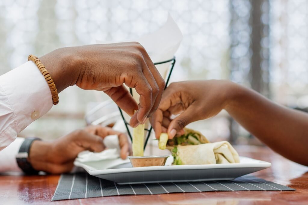 Table for two set for dinner in a small Ghanaian town restaurant in the evening