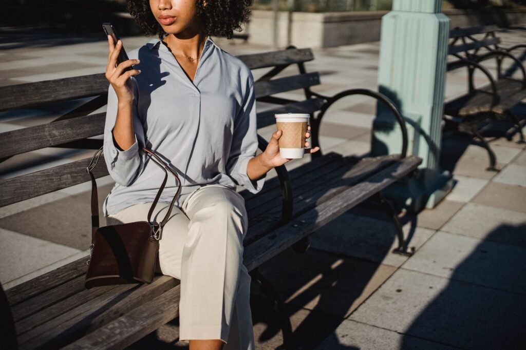 Person reviewing messages on a smartphone before a weekend trip