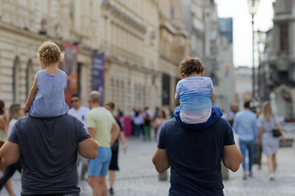 people, walking, promenade, children, street, urban, relaxation, weekend, men, fathers, family, snapshot, old town, city, cap