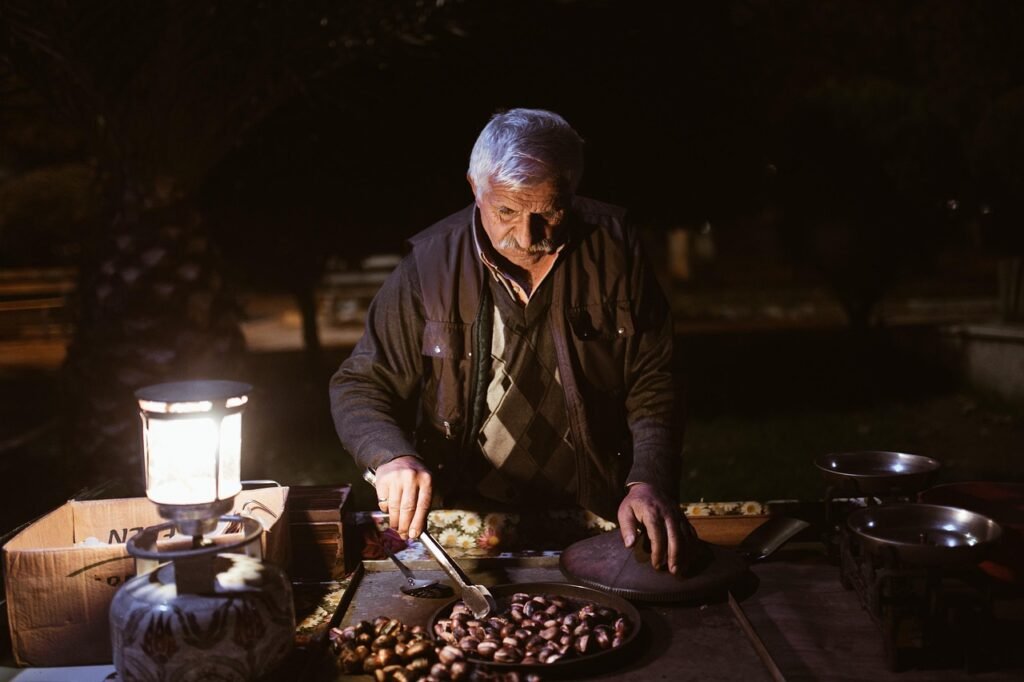 old man, night, chestnuts, peddler, street vendor, vendor, market, night market, elderly man, old man, old man, old man, old