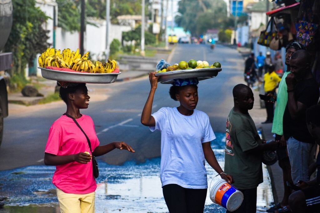 Two women selling bananas and limes on the streets of Monrovia, Liberia.