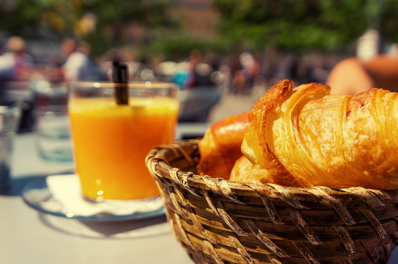breakfast, croissants, basket, orange juice, glass, table, outdoor, dining, bistro, brunch, cafe, brunch, brunch, brunch, bru