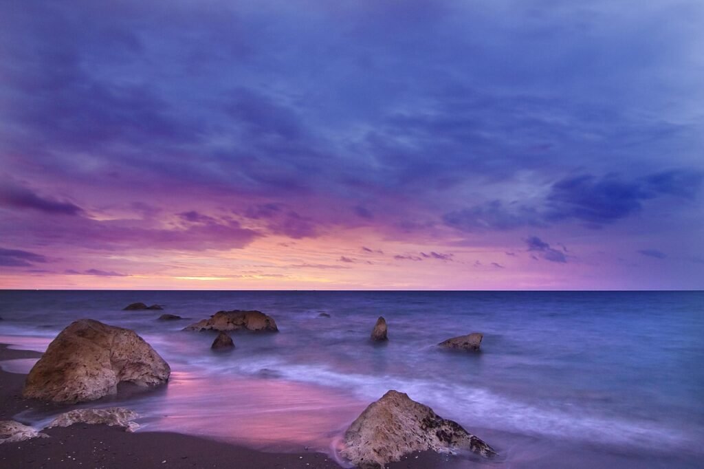 beach, sunset, rocks, shore, seashore, sand, sandy beach, horizon, ocean, seascape, dusk, twilight, afterglow, sky, clouds, d